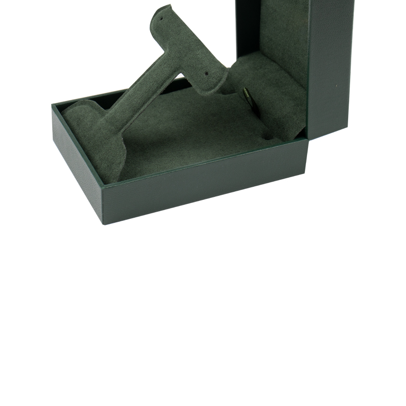 Green Rectangular Jewelry Box with Foldable Insert Green leatherette rectangular jewelry box with a foldable microfiber insert for earrings and a pendant.