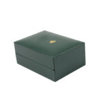 Green leatherette rectangular jewelry box with a foldable microfiber insert for earrings and a pendant.