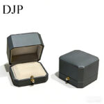 luxury blue leather double ring box with gray microfiber interior and diamond button