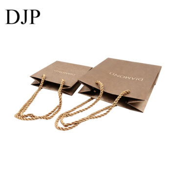 Gold paper jewelry shopping bags with rope handles and custom logo for retail packaging